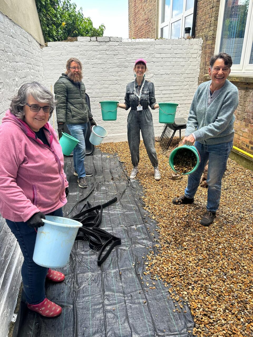 Volunteers working on courtyard