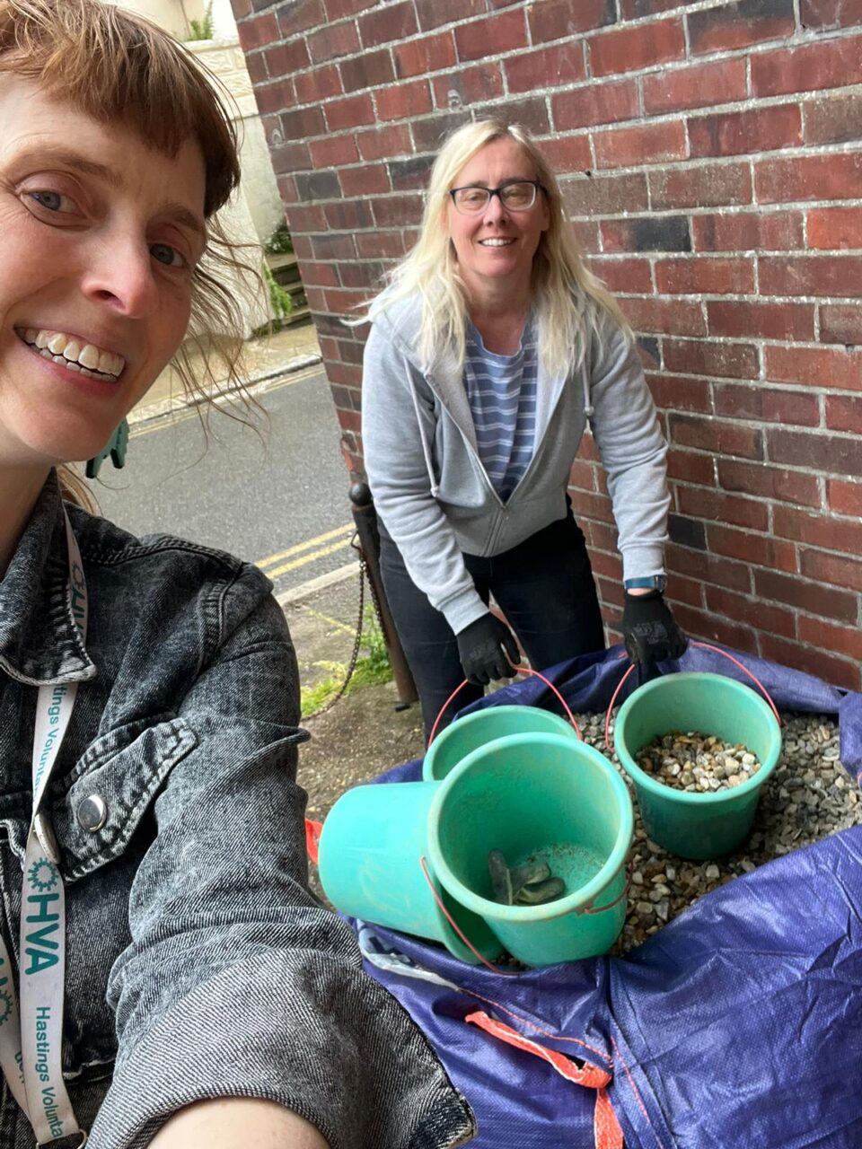 Hastings team members with buckets