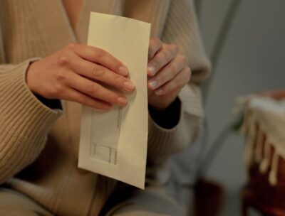 A person opening an envelope