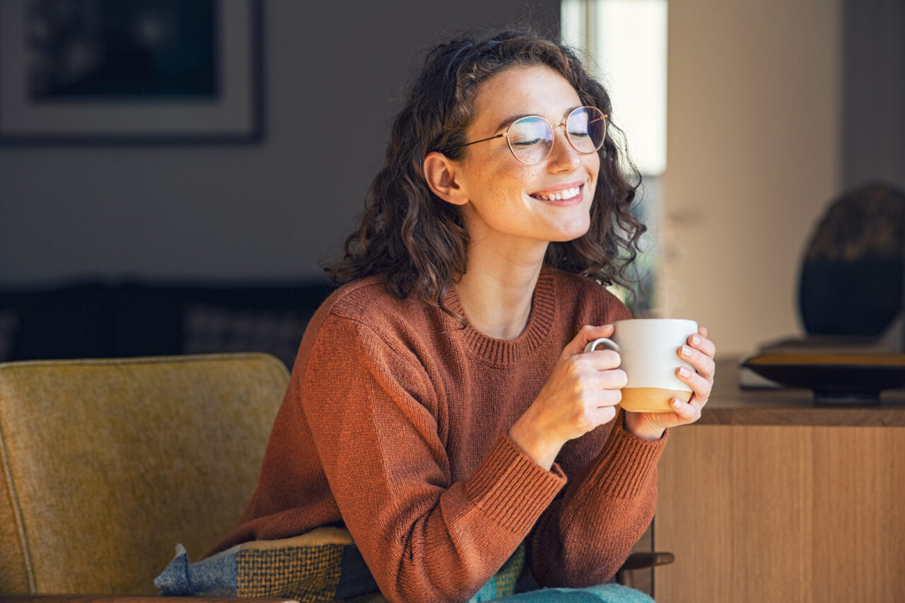 A woman relaxing and drinking hot tea